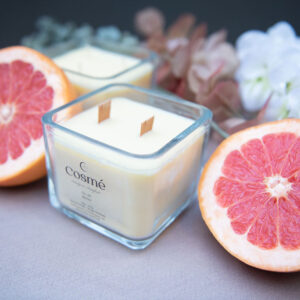 A bowl of freshly-picked citrus fruits, including grapefruit, orange, and citron, sits invitingly indoors, inviting one to enjoy the natural goodness of these delicious fruits.